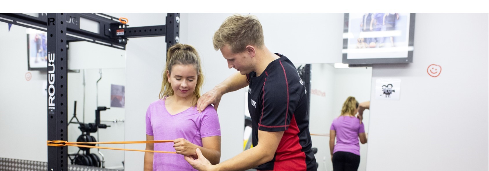 physiotherapist showing shoulder exercise for pain