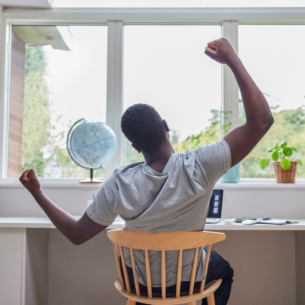 Man stretching at his desk